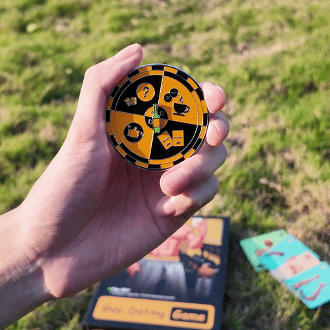 Hand spinning the original black and yellow game spinner